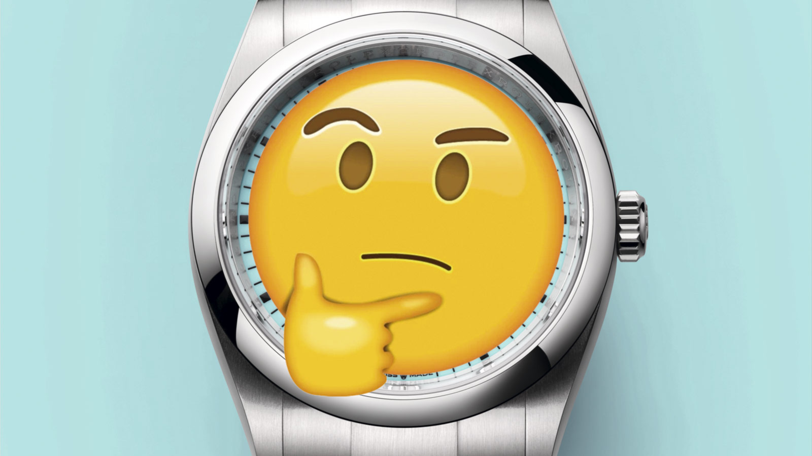En emoji ligger over skiven på en Rolex-klokke.